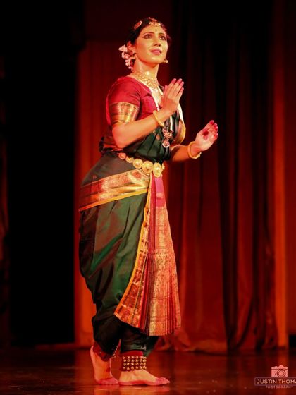 A moment of quiet grace during a solo performance. The ability to transition between dynamic movement and serene stillness is key to a captivating recital.