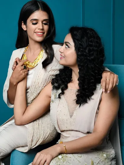 A candid moment from the Diwali shoot, showcasing the beautiful interaction and the elegance of the coordinated outfits.