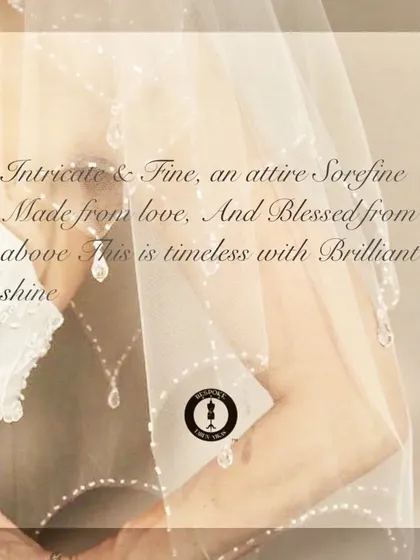 An artistic shot capturing the delicate, timeless beauty of a bridal veil with intricate pearl and crystal work.