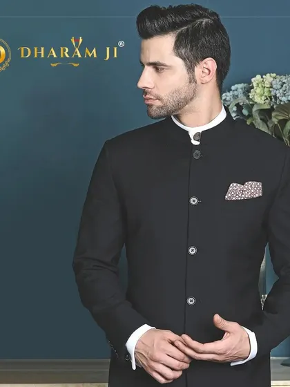 A classic black bandhgala suit, perfect for formal events. The clean lines and perfect fit make it a versatile and timeless addition to any man's wardrobe.
