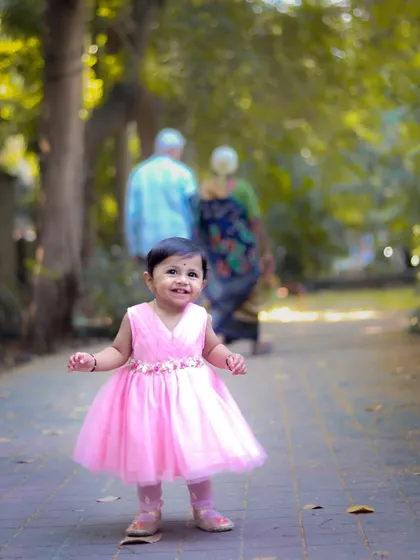 A beautiful moment during a multi-generational family shoot. Here, a little one explores the park while her grandparents watch on, creating a timeless family portrait.
