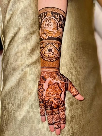 The full arm view of the baby shower mehandi, showing all the custom elements working together.