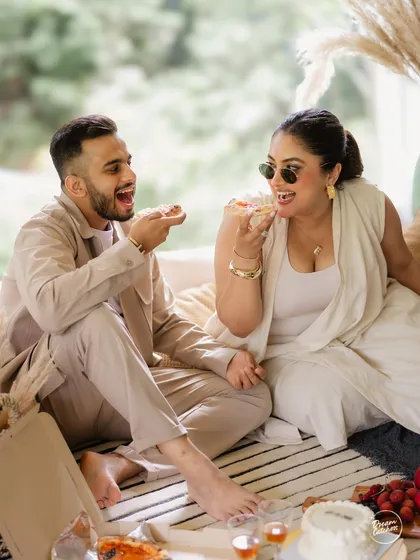 Love should be fun, and your photoshoot should be too. We believe in capturing the real you, whether that means sharing a pizza and laughing uncontrollably during a cozy indoor pre-wedding session. It’s these unscripted, joyful moments that tell your true story.