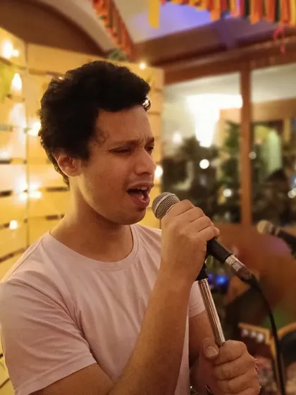 Caught in the moment during a live performance. This is where I feel most open, just me and the microphone.