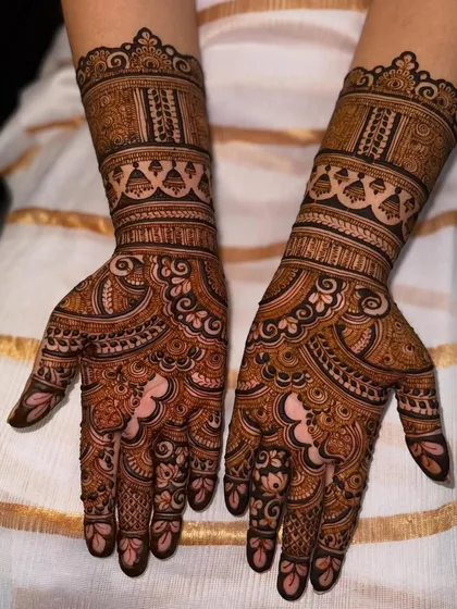 A clear shot of the engagement mehendi, highlighting the clean lines and symmetrical patterns.
