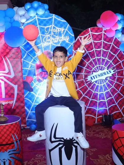 The birthday boy, Ayushman, enjoying his special Spiderman themed setup. We design our decorations to be a perfect photo opportunity for creating lasting memories.