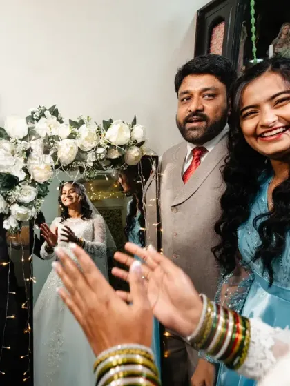 A moment of pure sibling love and joy as the family celebrates around the bride.