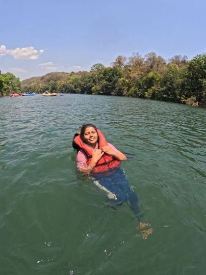 A trekker enjoying a swim in the river. All water activities are conducted with full safety measures.