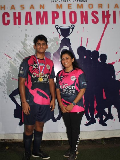 One of our top performers from the Hasan Memorial Championship 2023, proudly posing with a parent.