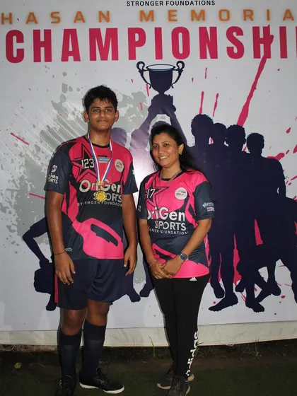 One of our top performers from the Hasan Memorial Championship 2023, proudly posing with a parent.