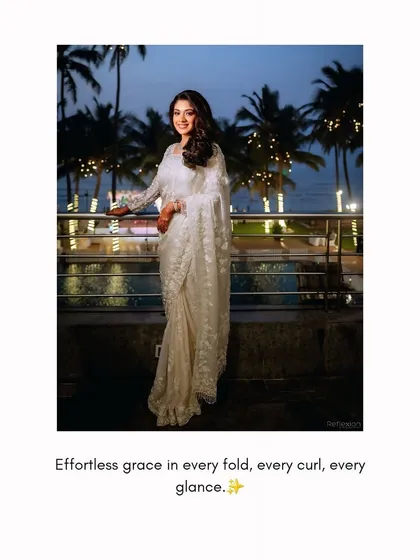 My bride Amrisha looking effortlessly graceful in a white saree for her reception. The look is all about timeless beauty with a modern twist.