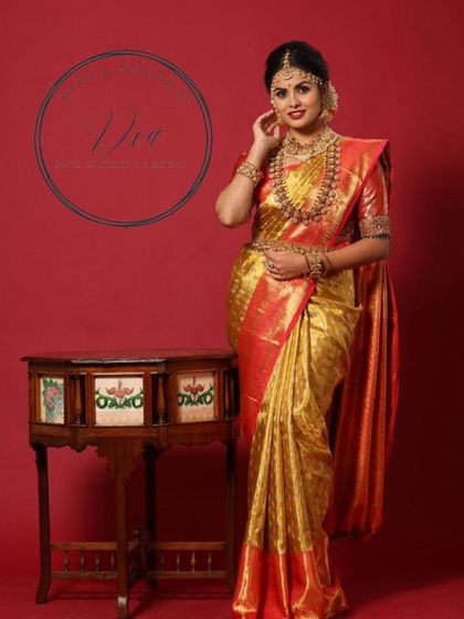 Another pose from the same shoot, highlighting the intricate details of the jewellery and the saree. The makeup remains the focal point, creating a look of timeless beauty and poise.