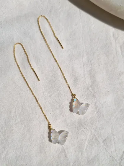 My rainbow moonstone butterfly 'sui dhaga' earrings. These threader earrings are a delicate way to wear the energy of transformation and intuition.