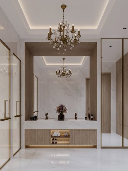 A full view of the white marble bathroom concept, showcasing the double vanity with integrated storage and the elegant, gold-framed shower doors. The space feels grand and luminous.