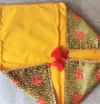 This view shows the traditional antarpat folded, highlighting the contrast between the printed and plain fabrics and the neat tassel details.