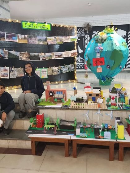 A wide view of the science exhibition, showcasing multiple sustainable city models. It was wonderful to see the collective creativity and hard work of all the students.