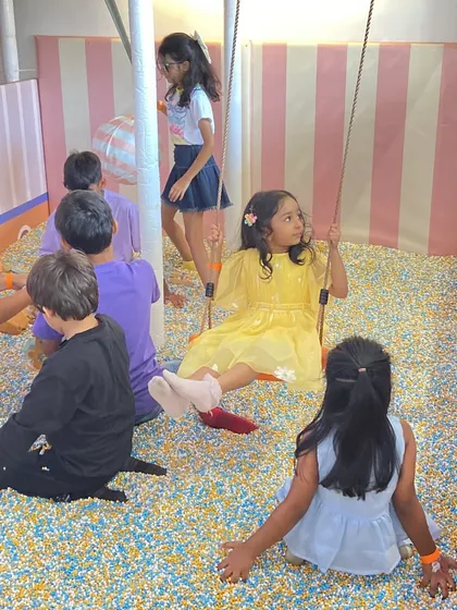 Kids relaxing and playing together in our unique cassia seed pit, which offers a different sensory experience from a traditional ball pit.