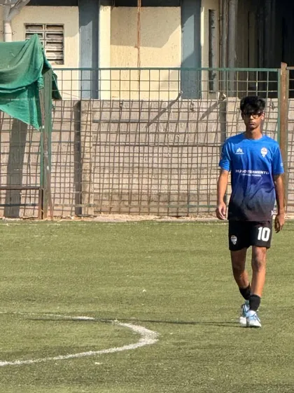 A player walks the pitch after a successful First Division game.