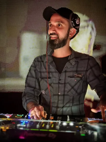 A smiling shot during a set. I believe that when the DJ is having a good time, the crowd has a good time too.