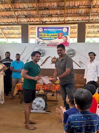 Receiving my certificate at a Silambam workshop. I am always a student, constantly learning new martial arts and fitness methods.