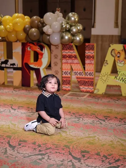 The pure joy of a birthday boy, Shrinay, sitting before his custom Lion King themed name display. Capturing these priceless moments is what my work is all about.