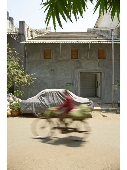 The discreet facade of Gallery Maskara, located in a former boat repair shed in a historic Mumbai lane. Our adaptive reuse approach respects the industrial character of the neighborhood while creating a contemporary art space within.