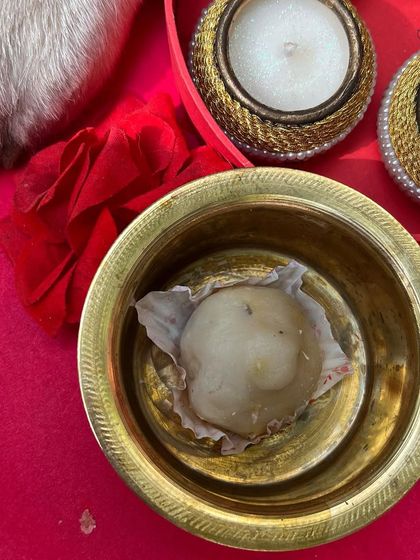 A single, delicious dog-friendly modak served in a traditional brass bowl. It's a perfect, safe offering for your beloved pet during Ganesh Chaturthi.
