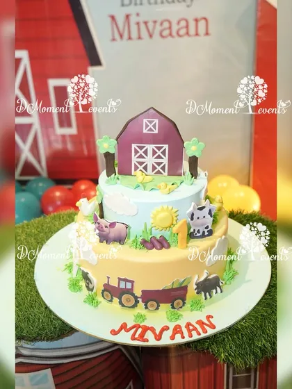 A delightful two-tiered farmland-themed cake, featuring a red barn, tractor, and various farm animals made from fondant.