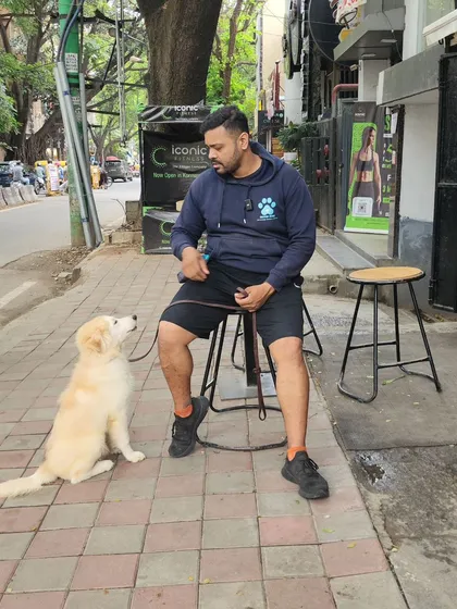 Having a serious discussion with Golu about the importance of good behavior. The reward? A delicious watermelon juice. Every moment is a training opportunity.