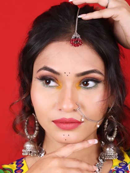 Another variation of a Navratri look, this time with a focus on yellow and green eyeshadow. This shows how I customize colors based on the outfit to create a unique and personalized festive style.