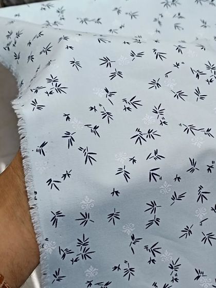 This is a high-quality kurta fabric with a delicate bamboo-like print. The light blue color and soft cotton make it ideal for hot weather.