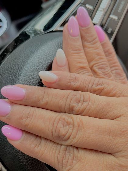 Beautiful shades of pastel purple nails. This manicure features a subtle gradient of lavender and lilac shades for a soft and dreamy look.