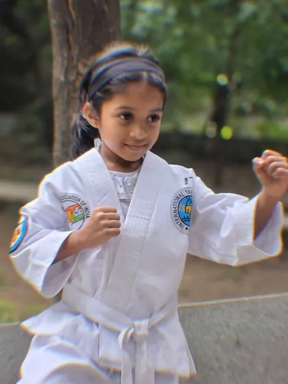 A close-up of our young student Nurain in her fighting stance, full of confidence and focus.
