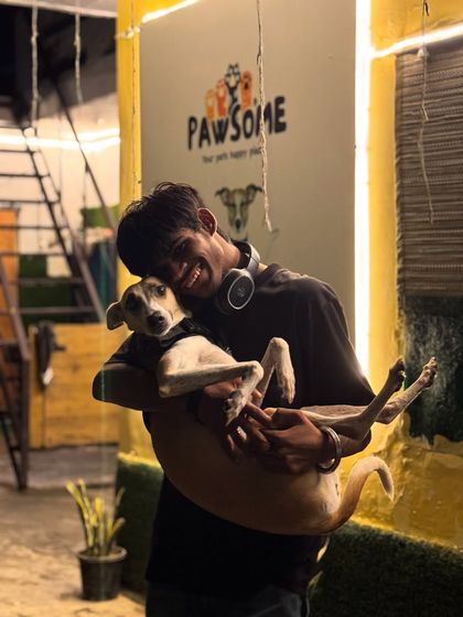 Cradling one of our more slender guests. Every dog gets the specific care and handling they are comfortable with.