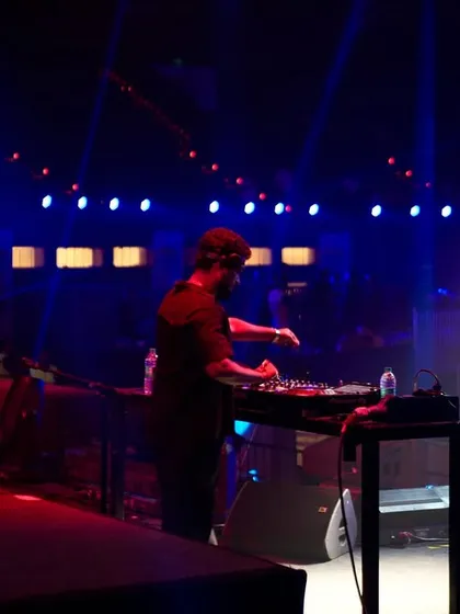 Adjusting the mix on a huge stage. Even in a large venue, my focus is on the fine details of the sound to ensure a perfect experience.