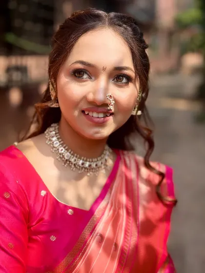 A happy, natural smile from the engagement day. The makeup is designed to enhance her features without feeling heavy, perfect for long events.