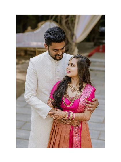 A classic couple portrait from the engagement, capturing their coordinated outfits and happy expressions.