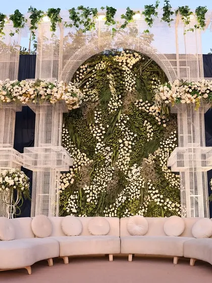 A quick glimpse of our work in Rajkot. This lounge area, set against a wall of green and white florals, showcases our ability to create beautiful, serene spaces. 🤍🍃