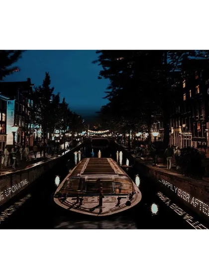 This earlier light installation for a festival plays with narrative and text. The phrases 'Once upon a time' and 'Happily ever after' are projected onto the canal walls, inviting those on passing boats to reflect on their own stories in a magical, dreamlike setting.