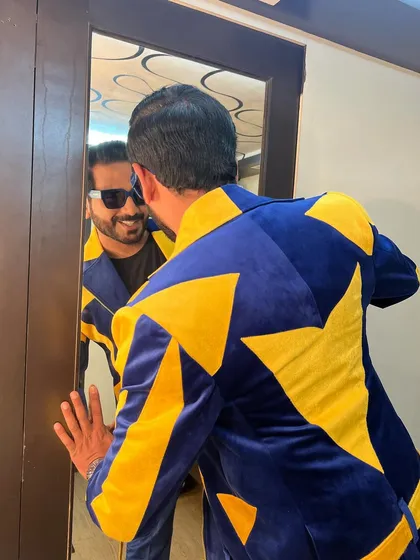Confidence comes from feeling good in what you wear. This bold blue and yellow star-patterned suit was a head-turner at the Rangraas Navratri event.