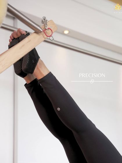 Precision in every detail. This close up shows the correct foot placement and engagement needed for an advanced exercise on the Cadillac.