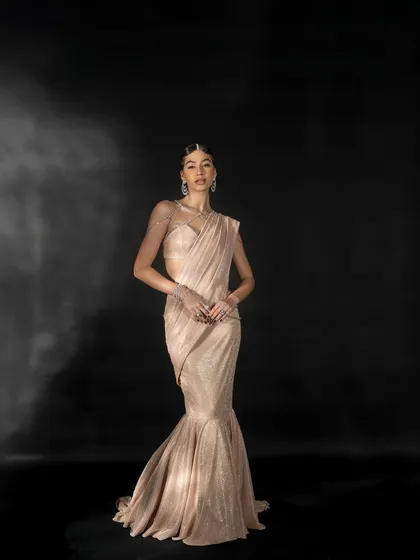 Another full-length view of the mermaid gown by Nikhil Thampi. This pose offers a slightly different angle, providing a comprehensive look at the garment for potential buyers.