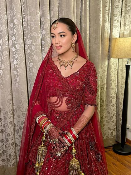 Simran in her stunning red Payal Keyal lehenga. The makeup was kept soft and minimal to let the outfit and her natural beauty be the focus.