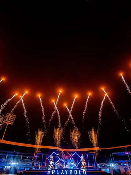 A massive display of fireworks lights up the night sky during the RCB Unbox event. We specialize in creating these high-impact moments that become the signature of a major sporting celebration.