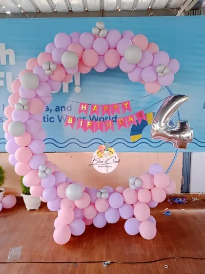 A simple and elegant balloon ring in pastel pink and purple for a 4th birthday.