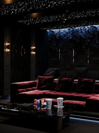 Transform your movie nights with a custom-designed home theatre. This one features grey and maroon tones, a cozy lounge sofa, and a star-like ceiling for the perfect cinematic ambiance. It's more than a space; it's an experience.