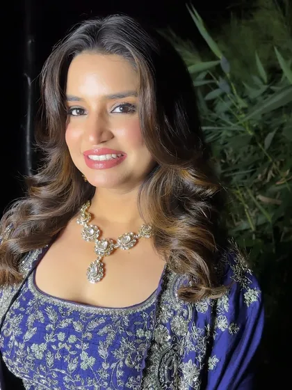 A close-up on the smile that says it all. This shot highlights the flawless skin and soft lip color that completes this beautiful and glamorous party look.