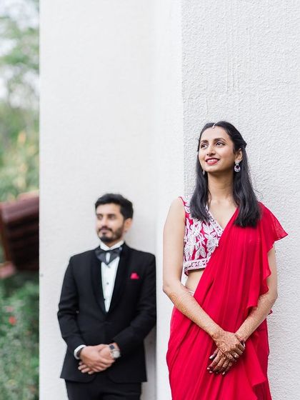 A duplicate of image 43, a creative portrait of a couple in formal wear, with the bride-to-be in the foreground.