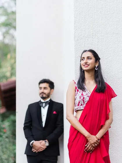 A duplicate of image 43, a creative portrait of a couple in formal wear, with the bride-to-be in the foreground.
