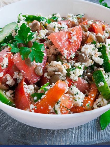 A refreshing summer salad with tomatoes, cucumber, and crumbled paneer. Salads are a great way to stay hydrated and get a variety of vitamins and minerals in one bowl.